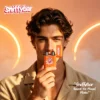 sniffybar-fruity-mango-magic-herbal-inhaler-mood-boost-usage-scene User holding Sniffybar Mango Magic portable fruity inhaler for mood boost