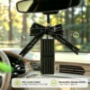 Premium hanging car air freshener with ribbon bow on a rearview mirror